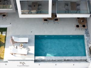 an overhead view of a swimming pool in a house at GeoMar Luxury Apartments in Skala Marion