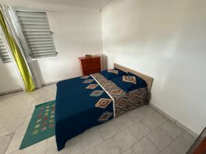 Postel nebo postele na pokoji v ubytování Caraibes Harmony - Vue Mer, Spa, piscine & confort + 5 fotografií