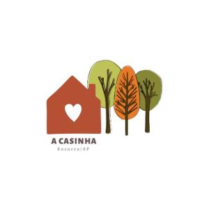 un ensemble d'arbres et un logo de maison dans l'établissement A Casinha, à Socorro