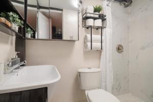 a white bathroom with a toilet and a sink at The Dream of Old San Juan by PH in San Juan +19 photos