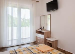 a bathroom with a sink and a mirror at Vržina Farm House Skadar Lake in Virpazar +42 photos