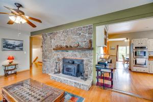 a living room with a stone fireplace at Breweries, Hiking Trails and Museums Monument House in Monument