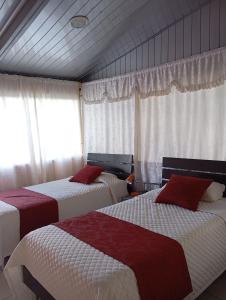 Postel nebo postele na pokoji v ubytování Hostal el Parque Tababela