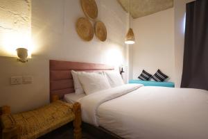 Postel nebo postele na pokoji v ubytování Dara Al Yammamah Hotel - Formerly Nuzl Shada
