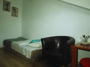 Uma cama ou camas num quarto em Zibi i Pod Topolami