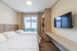 Postel nebo postele na pokoji v ubytování Apê novo a 1 min da Rua Coberta perfeito