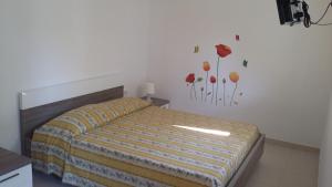 Postel nebo postele na pokoji v ubytování Camping Cala dei Ginepri