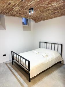 a bedroom with a bed with a wooden ceiling at Wagner's Refuge 2 in Rīga