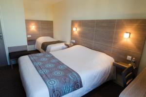 Llit o llits en una habitació de Auberge de la Loire