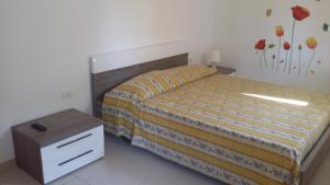 Postel nebo postele na pokoji v ubytování Camping Cala dei Ginepri