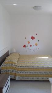 Postel nebo postele na pokoji v ubytování Camping Cala dei Ginepri