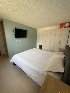 Postel nebo postele na pokoji v ubytování Hermoso Apartamento en Apulo