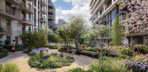 a garden in the middle of a building with flowers at Merino Gardens Deluxe 3 Bed by Tower Bridge in London