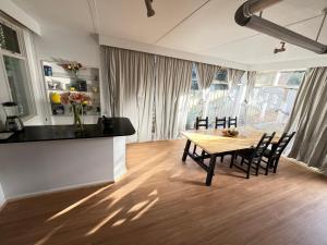 a kitchen and dining room with a table and chairs at kew house in Melbourne