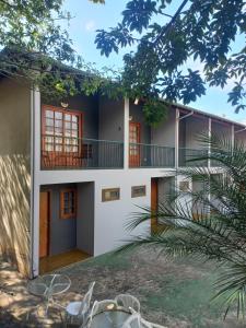 a rendering of a house with a balcony at Pousada Bicame de Pedra in Catas Altas