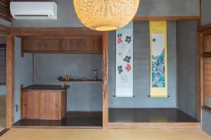 a room with a table and a shelf at Hotel TEN in Yuki