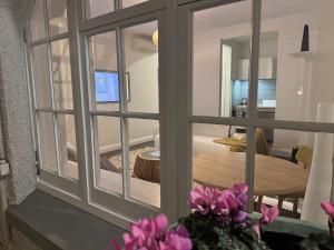a view through a window of a room with a table at Discerning in Thorndon in Wellington