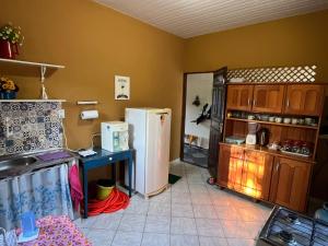 a kitchen with two refrigerators and a counter in it at Recanto da Vovó in Santarém