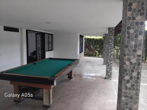 a pool table in the middle of a room at Villa kari in Palestina