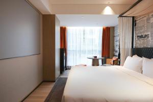 Arthur Hotel Baiyun Guangzhou客房内的一张或多张床位