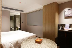 Arthur Hotel Baiyun Guangzhou客房内的一张或多张床位