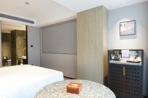 Arthur Hotel Baiyun Guangzhou客房内的一张或多张床位