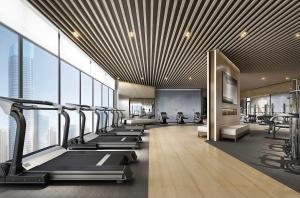 a gym with a row of treadmills and machines at Artisan Ratchada Spacious 2BR Condos in Bangkok +88 photos