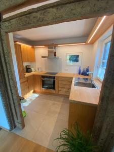 a kitchen with a sink and a counter top at Ferienwohnung Witt in Prien am Chiemsee