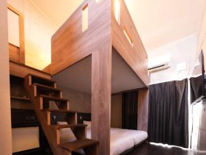 The BREAKFAST HOTEL MARCHE Ishigaki Island客房内的一张或多张床位