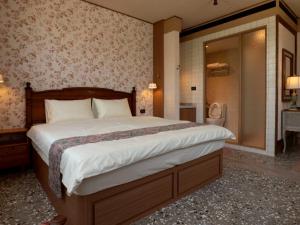 Uma cama ou camas num quarto em 成說時光文旅