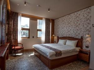 Uma cama ou camas num quarto em 成說時光文旅