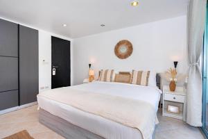 Un ou plusieurs lits dans un hébergement de l'établissement Kata Station Boutique Hotel