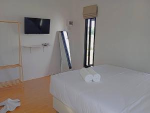 FIELD GOOD Resort at Chiang Rai客房内的一张或多张床位