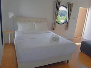 FIELD GOOD Resort at Chiang Rai客房内的一张或多张床位
