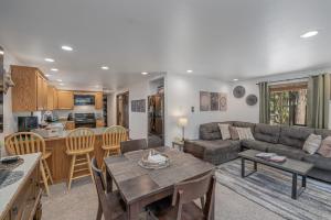 a living room with a couch and a table at Alpine Getaway home in Leavenworth