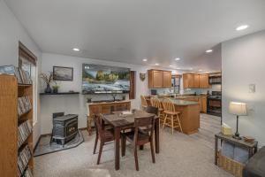 a kitchen and living room with a table and a stove at Alpine Getaway home in Leavenworth