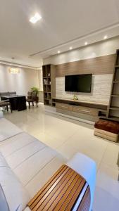 TV a/nebo společenská místnost v ubytování Viva a região central da cidade de Guarapuava!