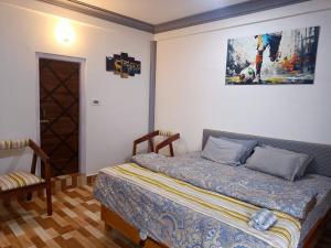 Postel nebo postele na pokoji v ubytování Nesting Abode Homestay