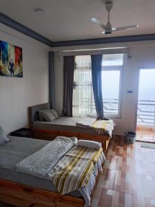 Postel nebo postele na pokoji v ubytování Nesting Abode Homestay