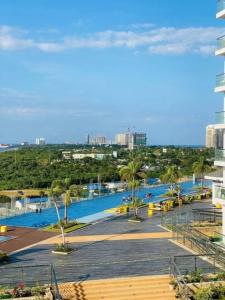 a view of the pool at a resort at Mactan Newtown township staycation with pool access in Lapu Lapu City