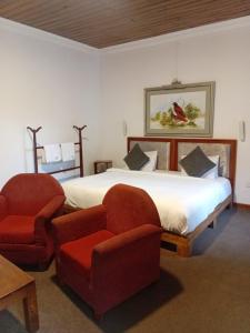 Postel nebo postele na pokoji v ubytování Tea Bush Hotel