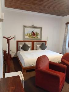 Postel nebo postele na pokoji v ubytování Tea Bush Hotel