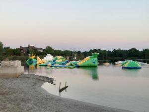 a bunch of inflatable boats in the water at Ostfrieslandsuite in Aurich