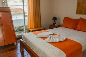 Postel nebo postele na pokoji v ubytování HOSTAL DEL RÍO