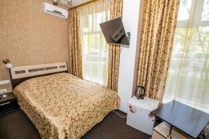 Voodi või voodid majutusasutuse Mini Hotel Voyage toas