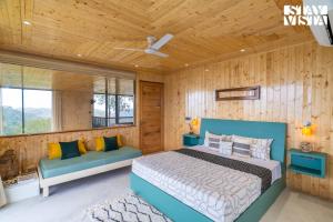 a bedroom with a bed and a wooden wall at StayVista at Petal Perch 4 BR and 2 BR with Bonfire in Kasauli in Kasauli