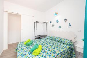 Łóżko lub łóżka w pokoju w obiekcie Gran Sol Family 6