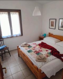 Ένα ή περισσότερα κρεβάτια σε δωμάτιο στο Bouganville