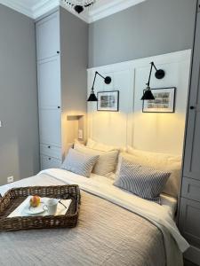 a bedroom with two beds with a tray of food on it at SeeBlick Apt 7 Bałtyk Luxury Residence in Międzyzdroje