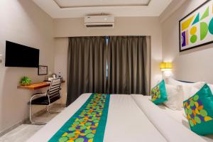 Voodi või voodid majutusasutuse Treebo Riwaayat Regency toas
